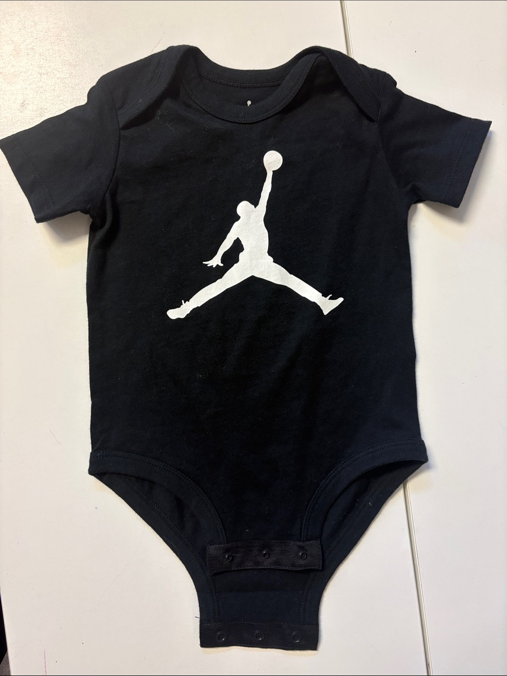 Jordan Black One-Piece Bodysuit with White Jumpman